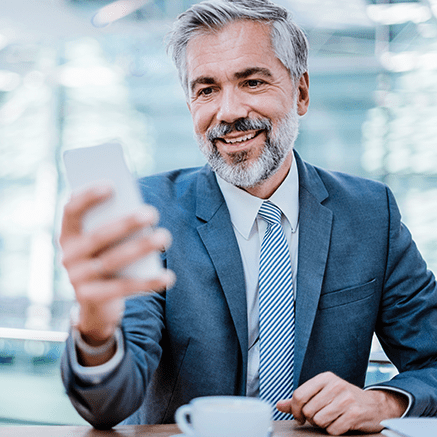 business man looking at mobile phone