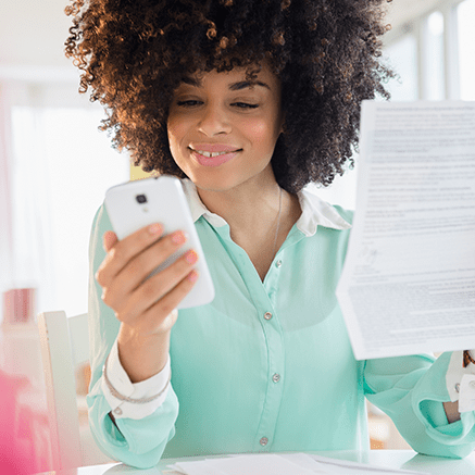 woman looking at mobile phone