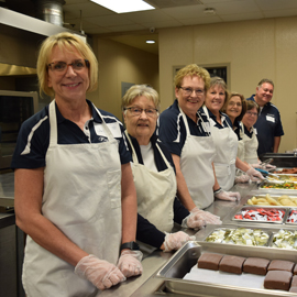 PREMIER Employees serving in buffet line 