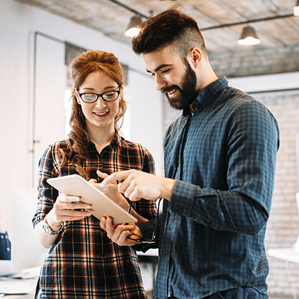 Man and woman looking at tablet