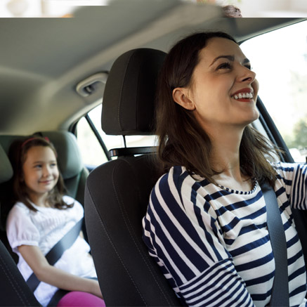 woman riding in car with daughter