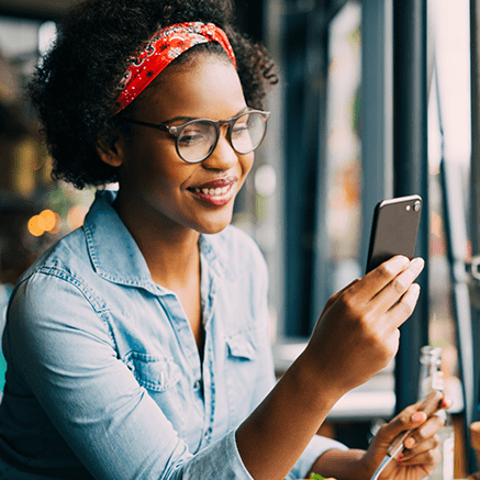 woman looking at mobile phone