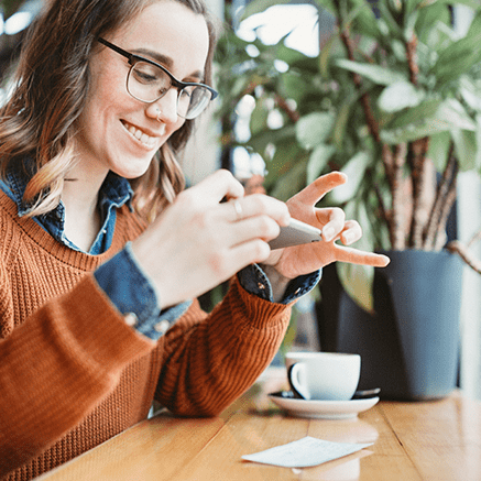 woman depositing check with mobile phone