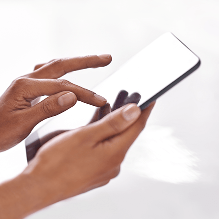 woman's hands using mobile phone